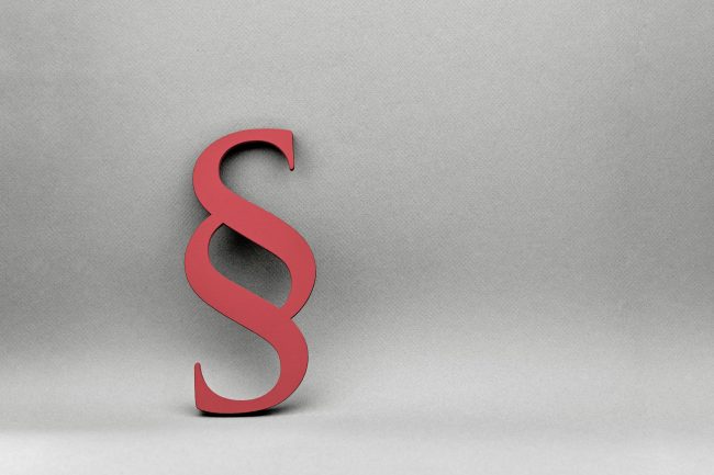 Hintergrund mit Paragraph für Recht und Gesetz