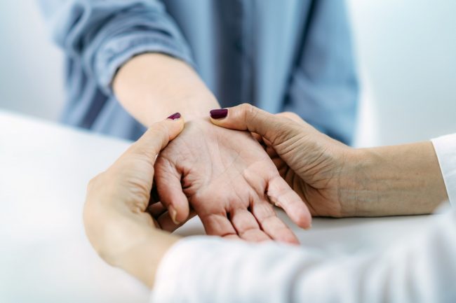 Examining Hand of Senior Patient with Carpal Tunnel Syndrome. Close-up Image of Senior Woman’s Wrist.
